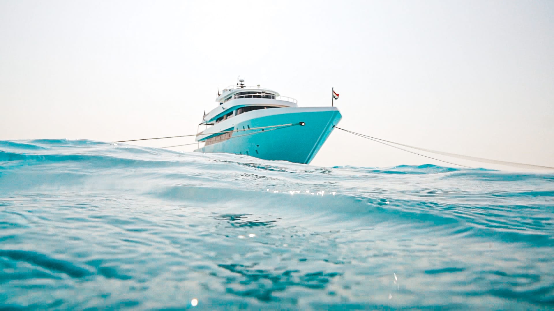 Kitesurfing in the Red Sea with desert mountains in background